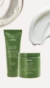 Aveda be curly styling cream and curl definer gel tubes with swirled cream textures on a white background.
